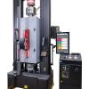 Instron 6800 Series Floor Model Universal Testing System configured with advanced hydraulic wedge grips powered by floor standing hydraulic grip pump - also configured with Advanced Video Extensometer installed on the outside of an environmental chamber for non-ambient testing.